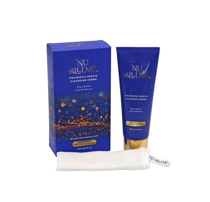 A tube of Nu Allumé Postbiotic Papaya Cleansing Creme with its box and free Cleansing Cloth