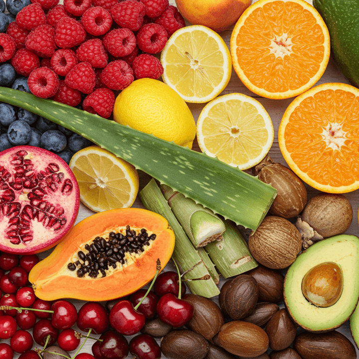 A bundle of different raw ingredients that  go into Nu Allumé products such as citrus fruit, berries, seeds and aloe vera